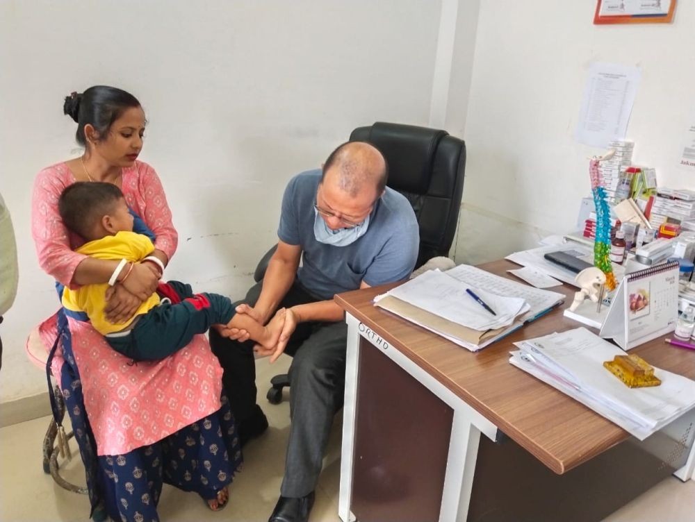 Dr Visietsolie Vupru, Orthopedic Surgeon at the District Hospital Dimapur examines a child during a Free Clubfoot Camp held at the hospital on March 22.